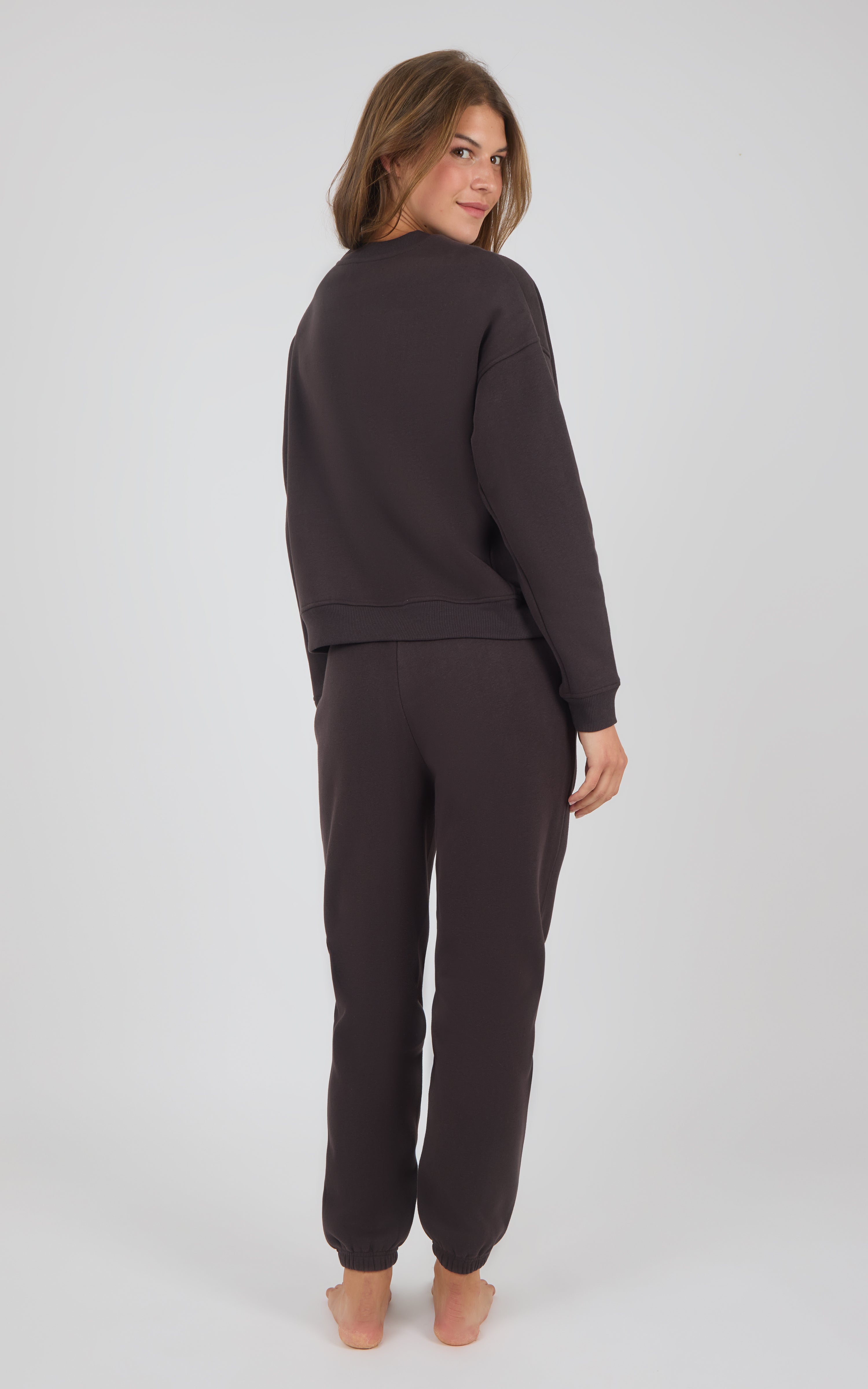 Dark Coco pintuck jogger pants with matching relaxed-fit top in soft fabric, shown from back view.