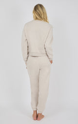 Heather oatmeal pintuck jogger pants with matching long-sleeve top, relaxed fit, soft fabric.