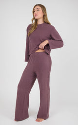 Woman wearing a plum marled long-sleeve cropped top and matching straight-leg pants with a soft pique texture.