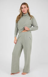 Model wearing a sage gray marled long-sleeve pullover and matching wide-leg pants with pintuck detailing.