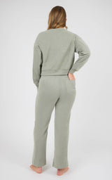 Model wearing a sage gray marled crewneck pullover and matching wide-leg pants, shown from behind.