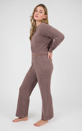 Model wearing a mauve marled-piqué crew-neck pullover and matching wide-leg pants with side pockets.