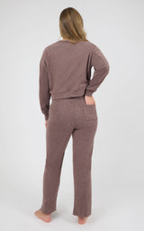 Model wearing a dusty mauve marled long-sleeve crewneck and matching wide-leg pants, shown from behind.