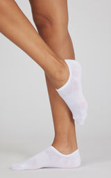 White no-show socks with a low-cut design, shown worn on both feet with one foot raised.
