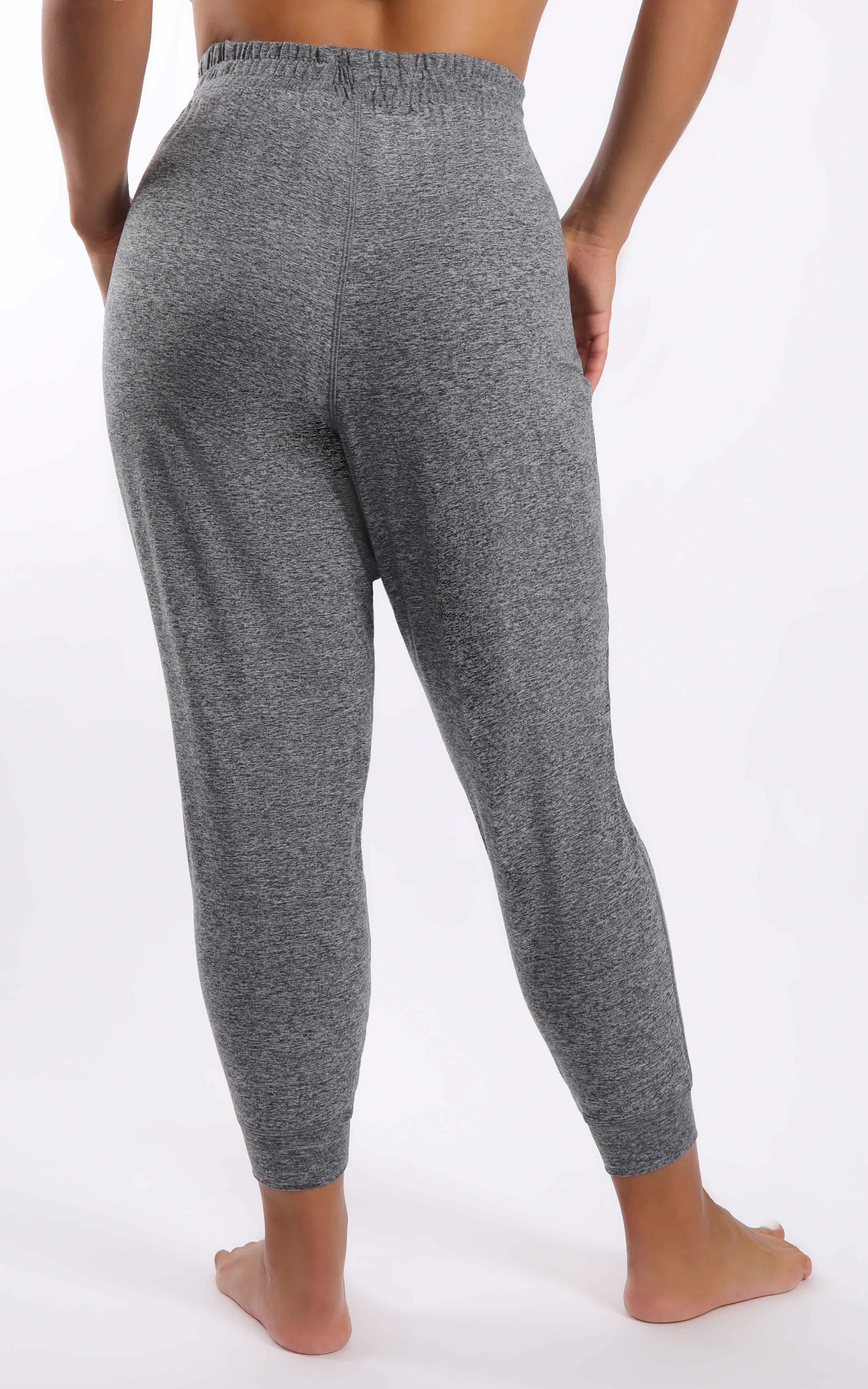 Plus size slim ankle joggers in heather grey with elastic waistband and tapered legs.