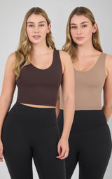 Two women model cropped scoop-neck tank tops with built-in bras in dark brown and beige, paired with black leggings.