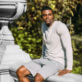 Men's light grey crew neck long sleeve shirt paired with matching shorts outdoors.