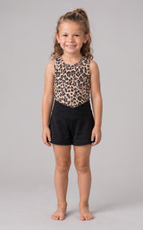 Girls’ two-piece set with a sleeveless leopard-print tank and black crossover-waist shorts, modeled barefoot.