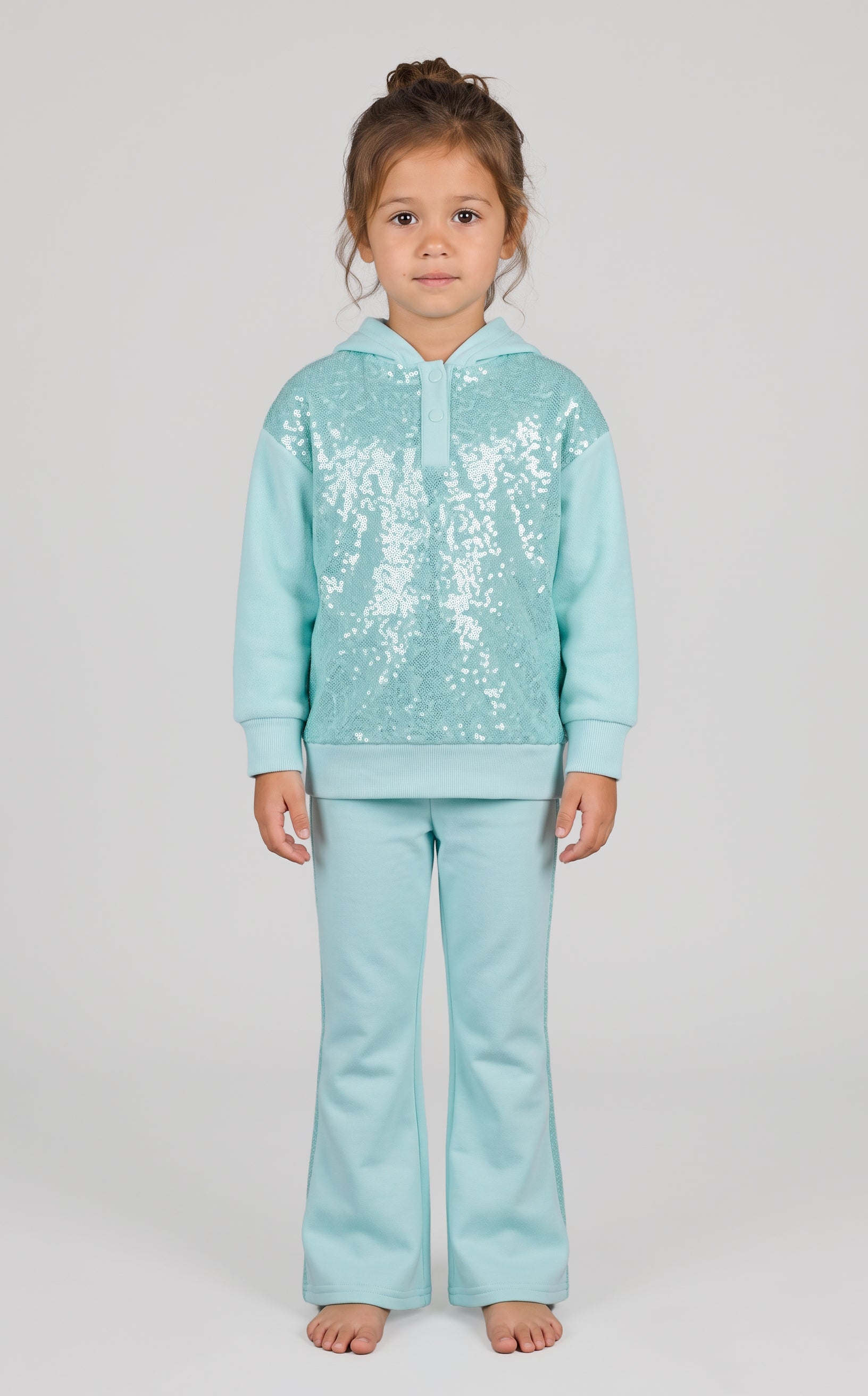 Light blue toddler girls two-piece set with a zip-up pullover featuring white snowflake patterns and matching flared pants.