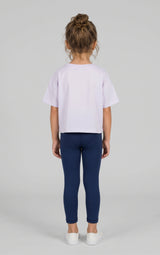 Toddler in navy full-length leggings and a pale lavender short-sleeve top, shown from behind.