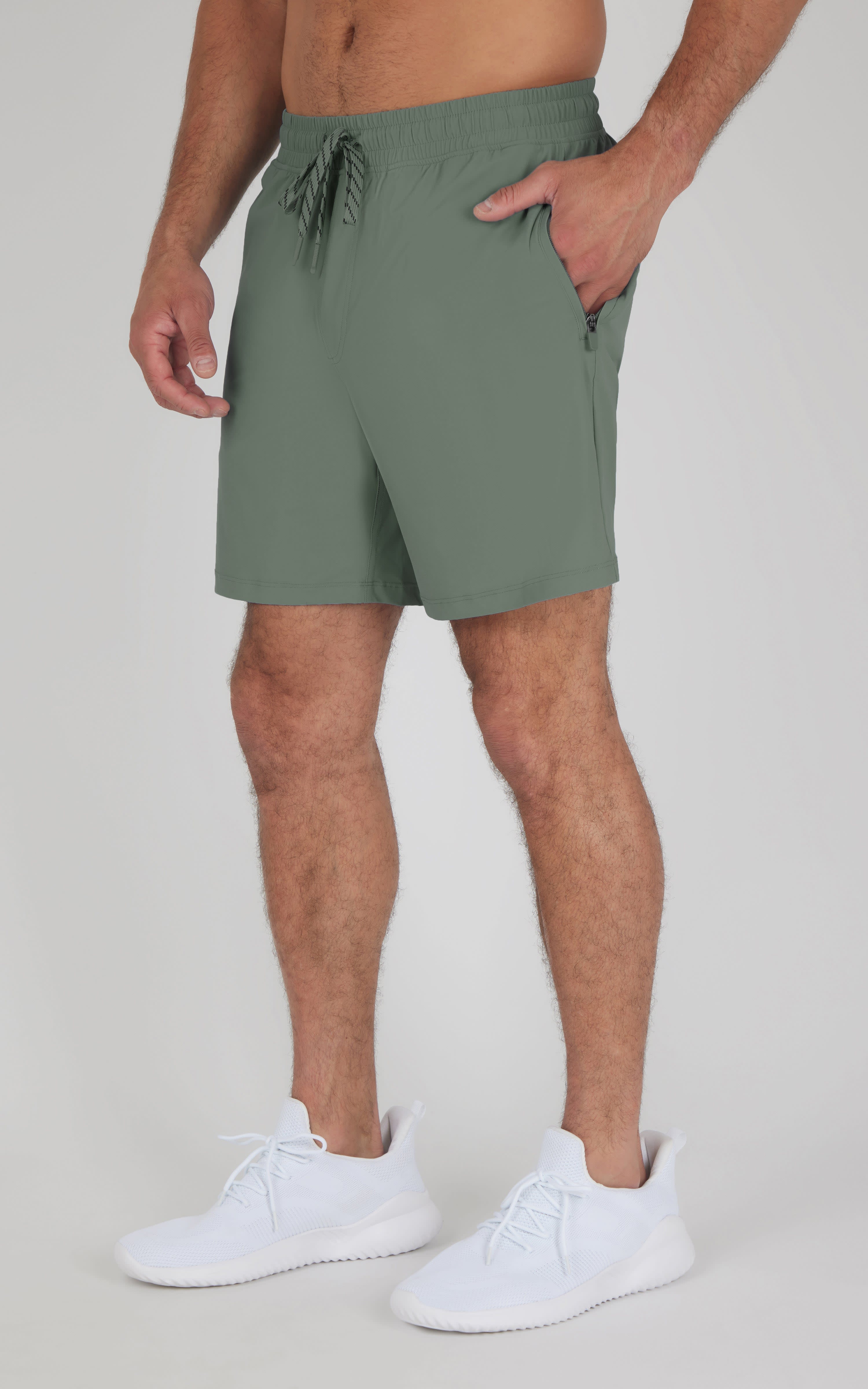 Men's agave green 7" athletic shorts with drawstring waist and side pockets.