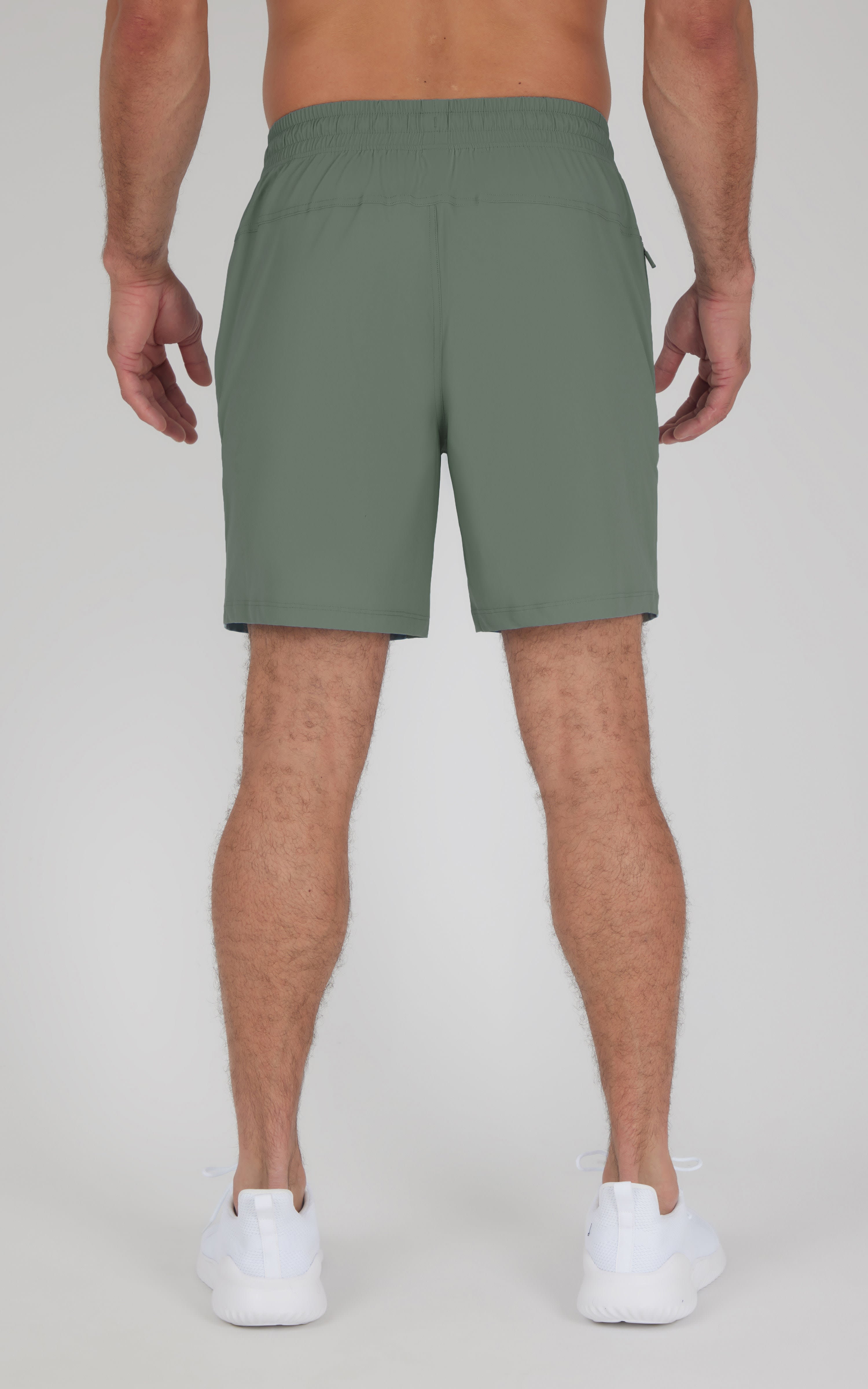 Men's agave green athletic shorts with elastic waistband and back seams.