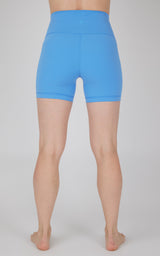 Women’s 5-inch high-waisted bike shorts in solid bright blue fabric.