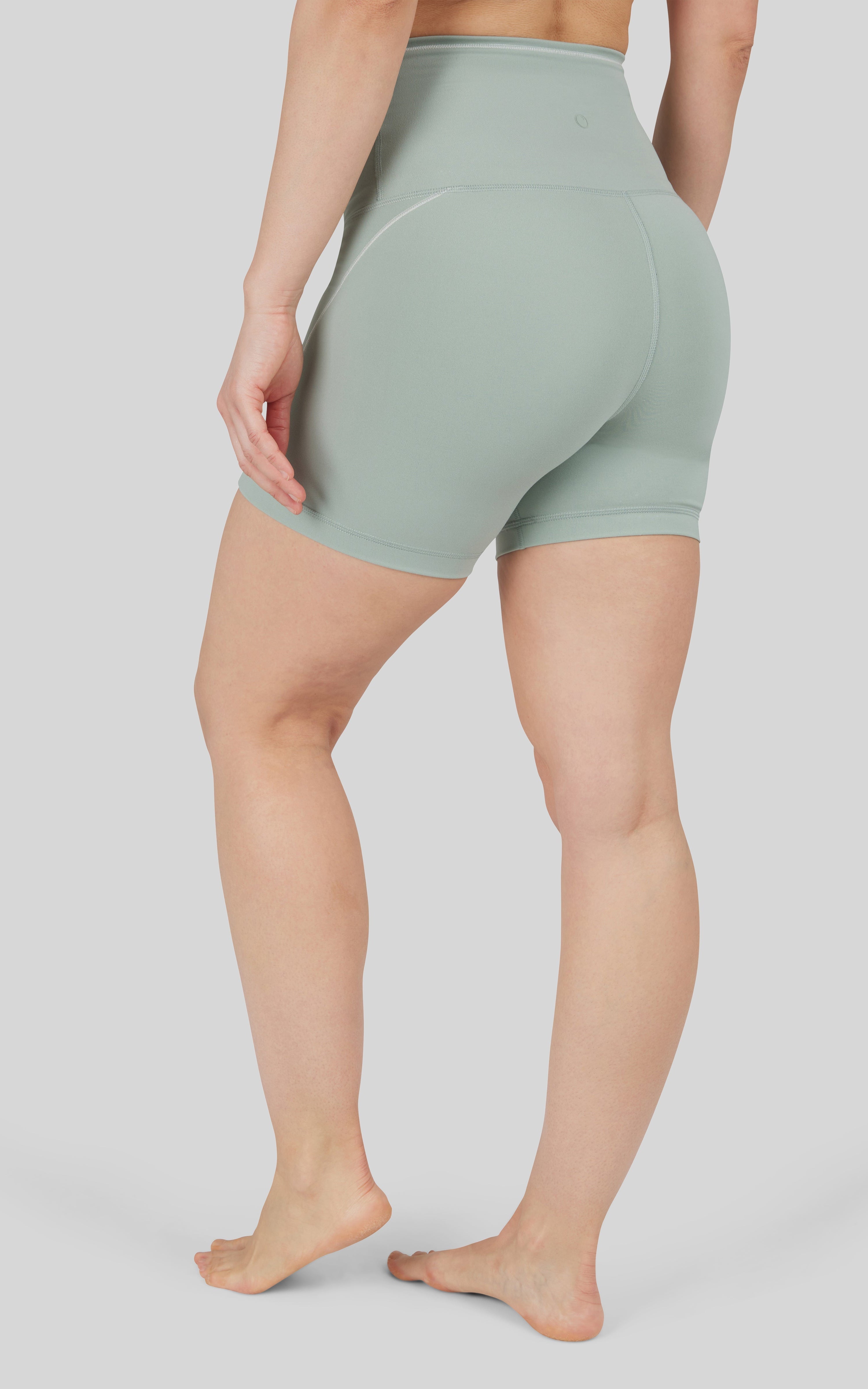 Light green super high waist bike shorts with a 5-inch inseam and smooth fabric finish.