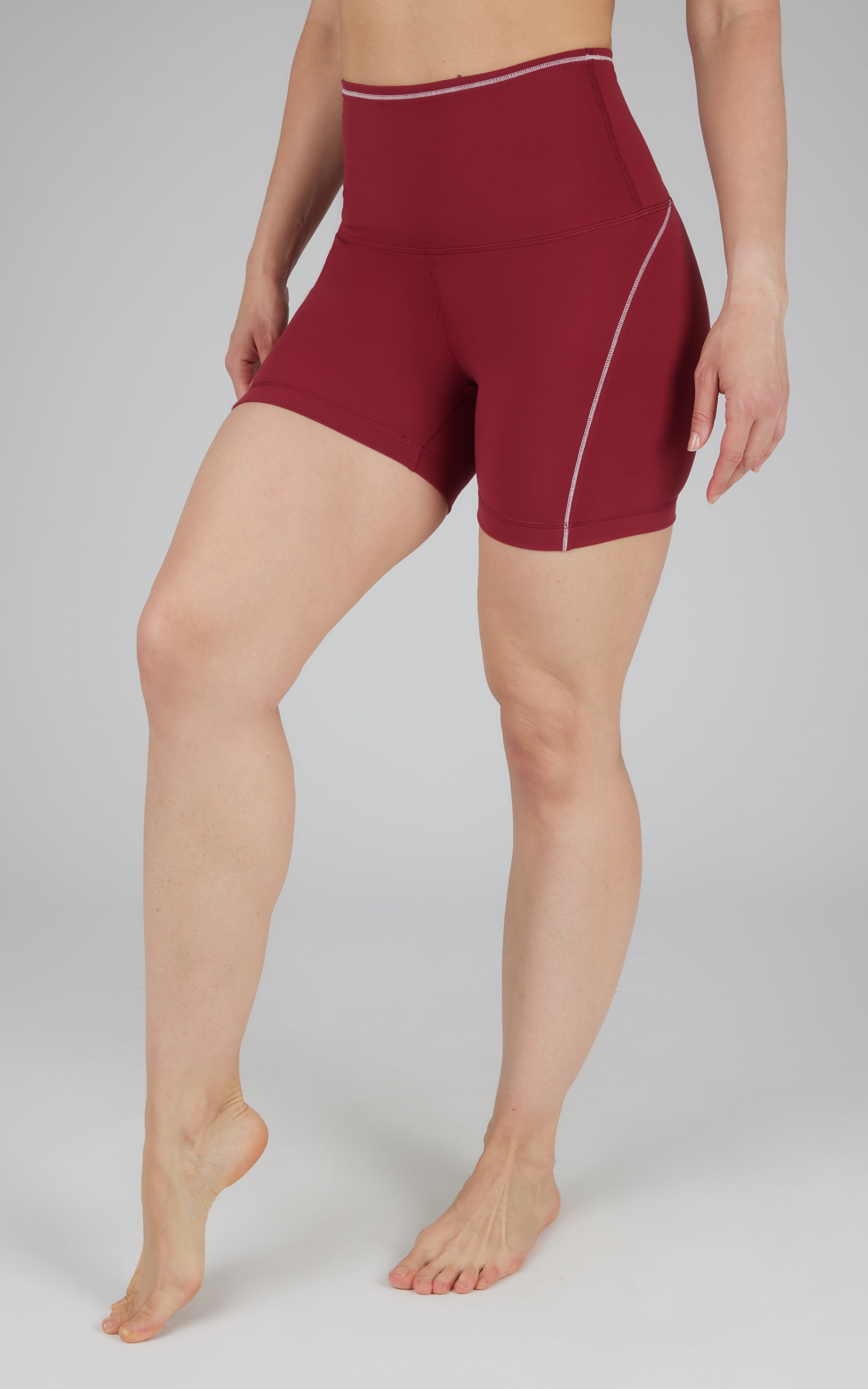 Tibetan red high-waist bike shorts with 5-inch inseam and white side stitching.