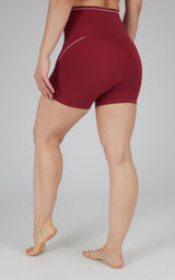 Tibetan red high-waist bike shorts with 5-inch inseam and subtle seam detailing.