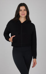 Black brushed inside hoodie jacket with front pockets, worn with black leggings.