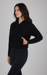 Black brushed inside hooded jacket with front pockets, worn with black leggings.