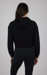 Black cropped hooded jacket with brushed inside, long sleeves, and fitted waistband, shown from back.