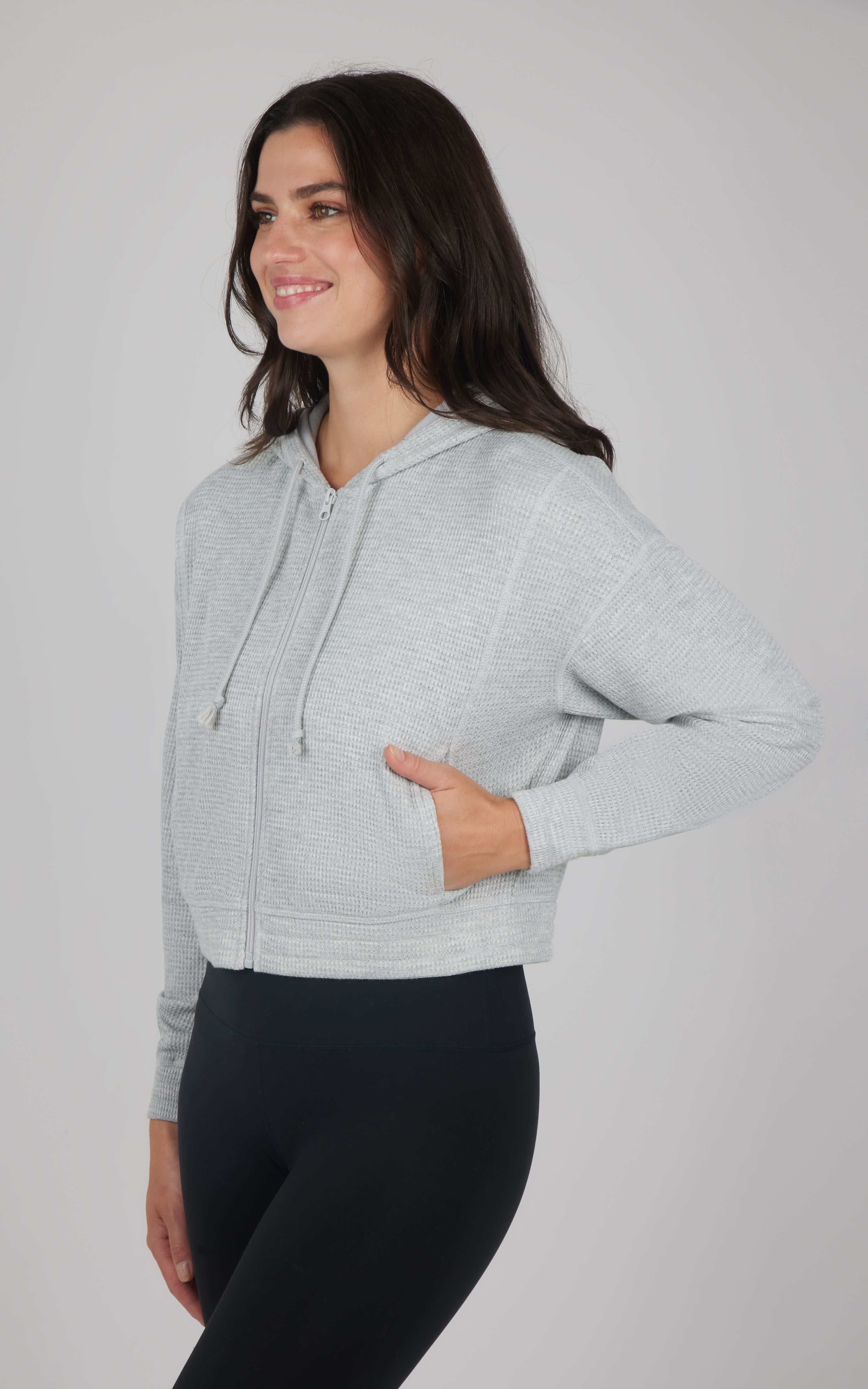 Heather grey hooded jacket with brushed inside, front pockets, and drawstring hood.