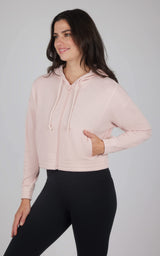 Light pink cropped hoodie jacket with brushed inside, kangaroo pocket, and drawstring hood.