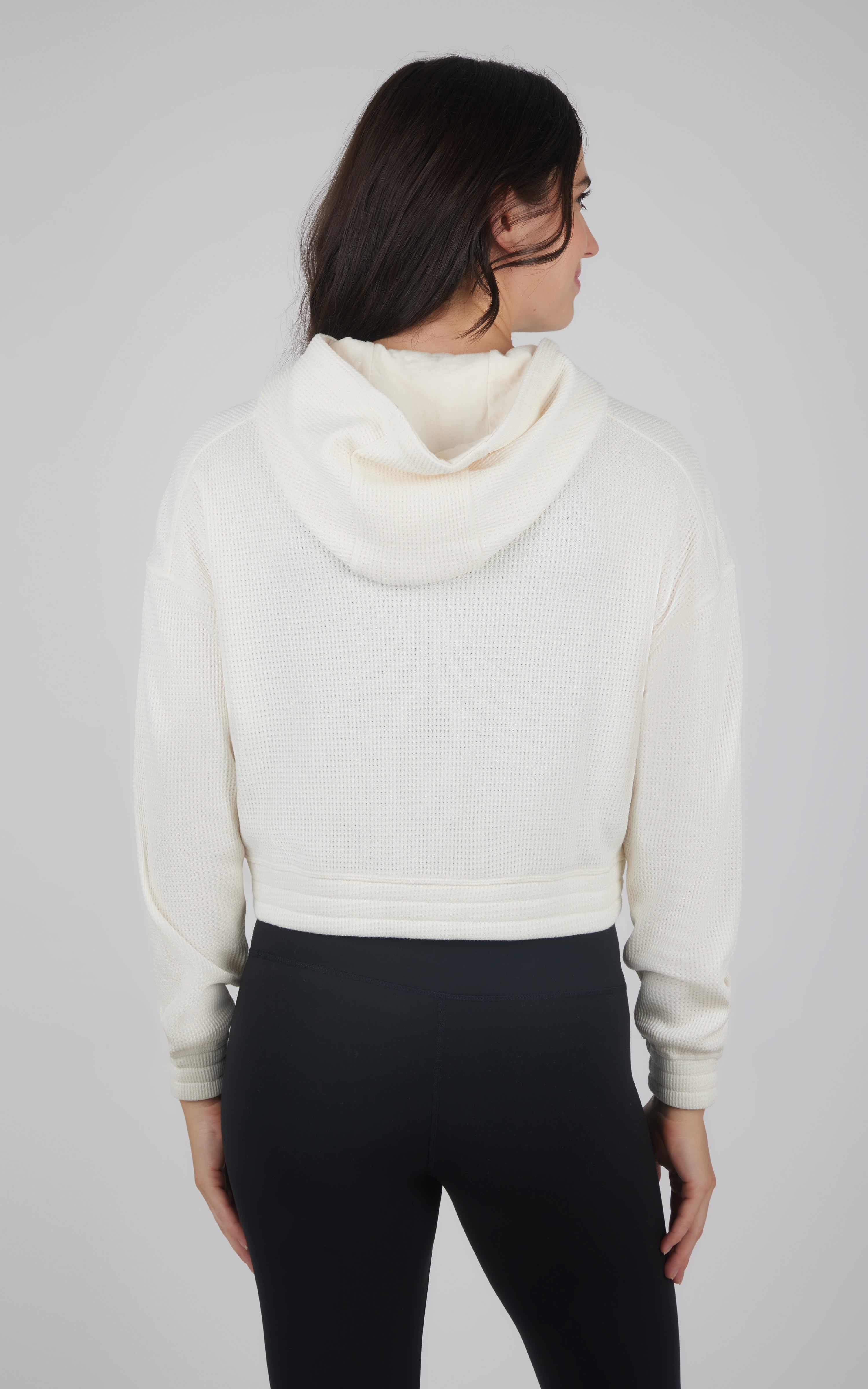 Women's cropped hooded jacket in soft nacreous cloud white with brushed interior and relaxed fit.