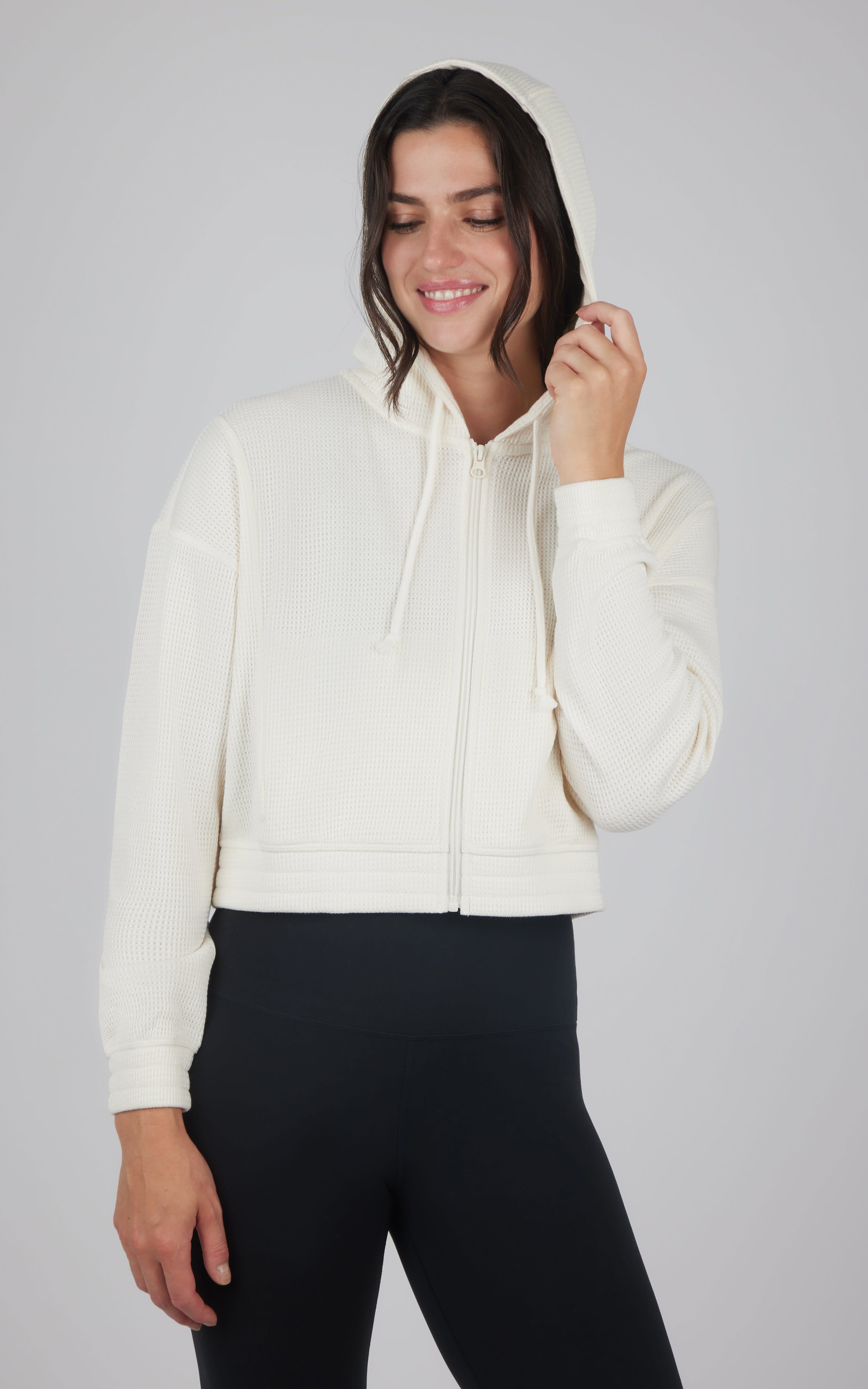 Women's cropped nacreous cloud hooded jacket with front pockets and drawstring hood.