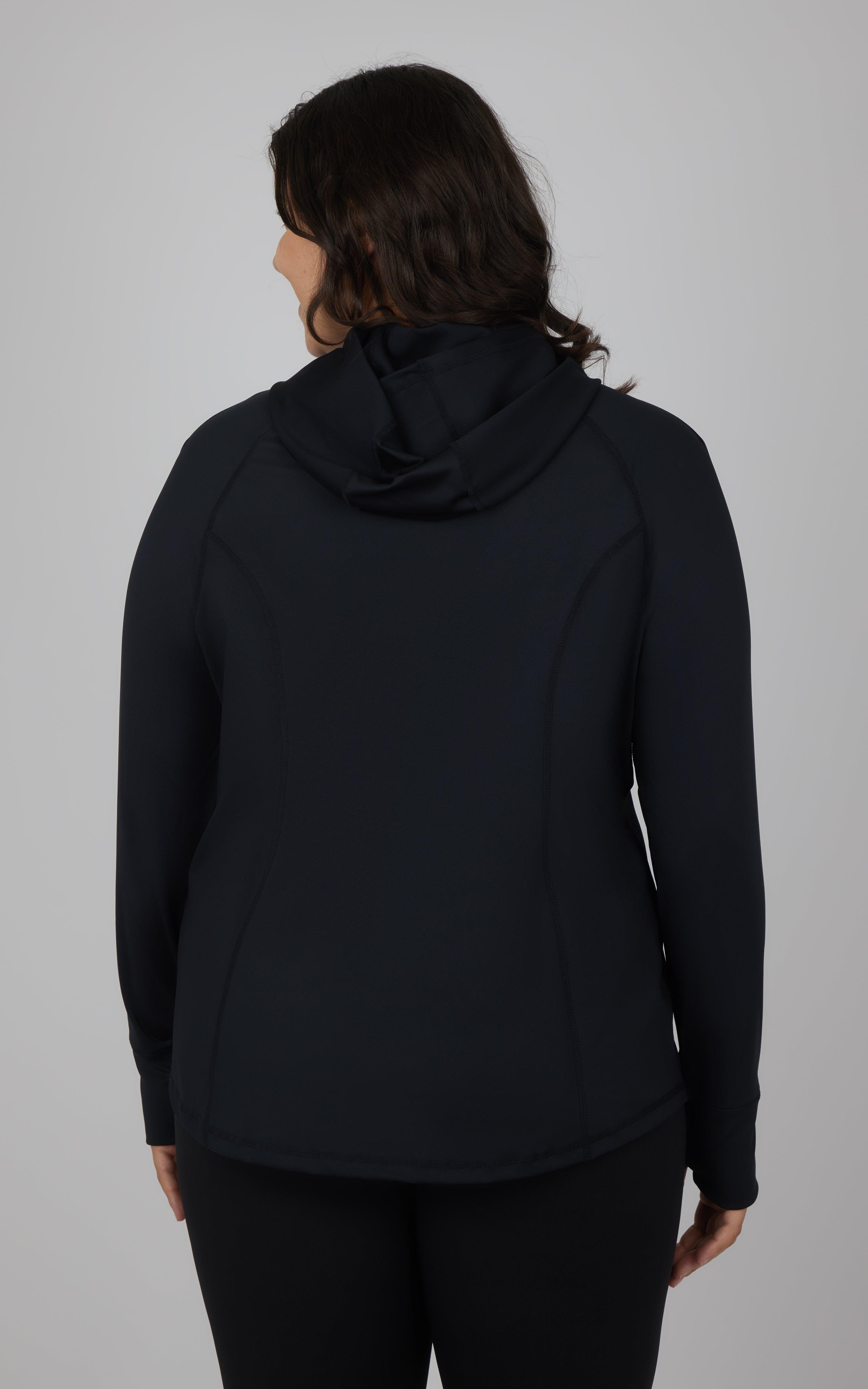 Plus size black slim fitted full zip hooded jacket with long sleeves and curved seam details shown from back.
