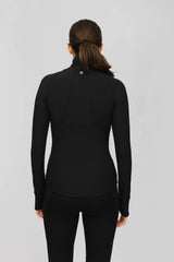 Back view of a fitted black ribbed performance jacket with a mock neck, full zip, and long sleeves.