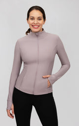 Fitted dusky orchid ribbed jacket with a full zip, mock neck, long sleeves, and front pockets.