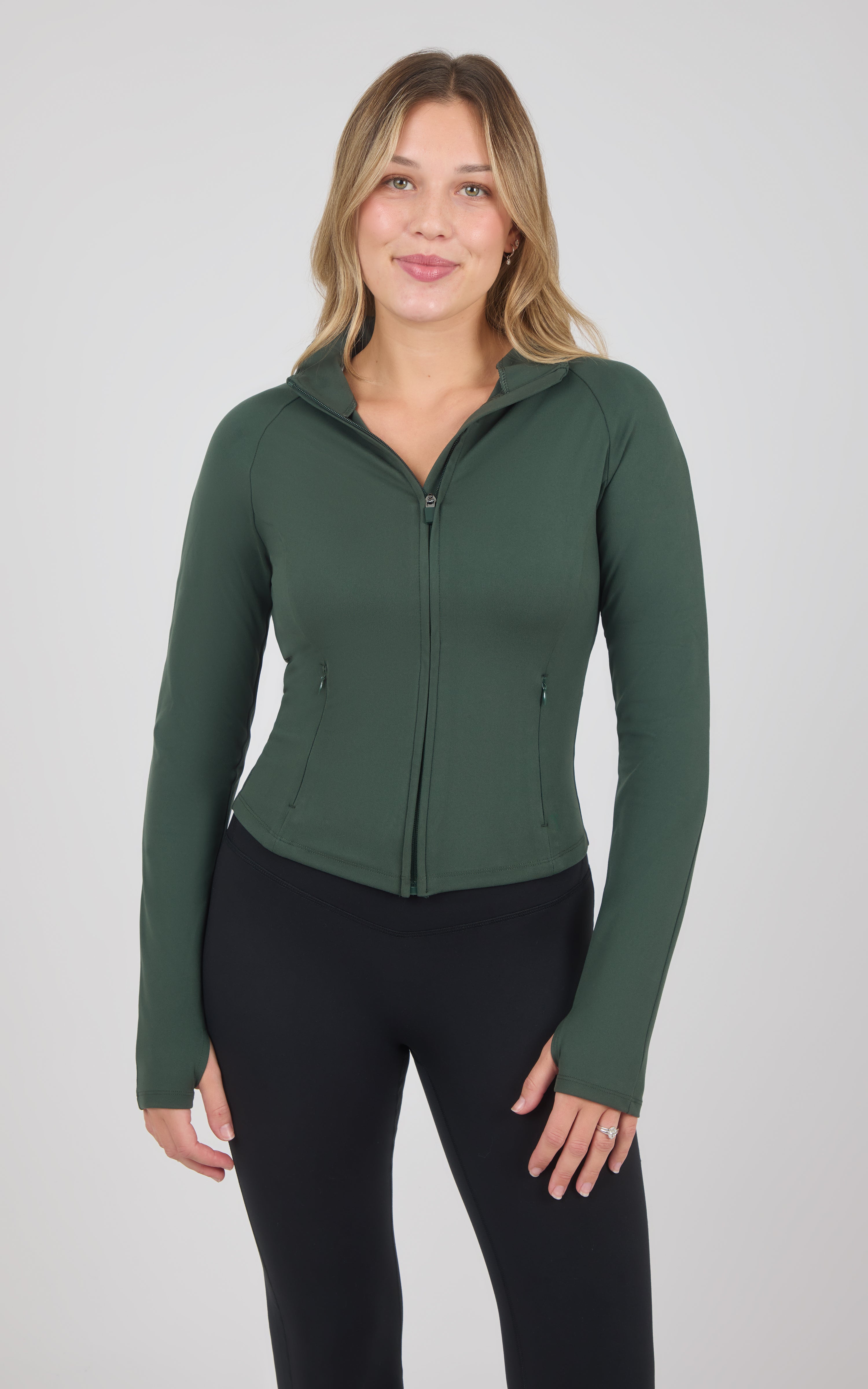Deep forest green full zip raglan jacket with fitted silhouette and thumbhole cuffs.