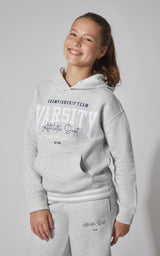 Girls light grey fleece pullover hoodie with front pouch pocket and varsity-style lettering on chest.