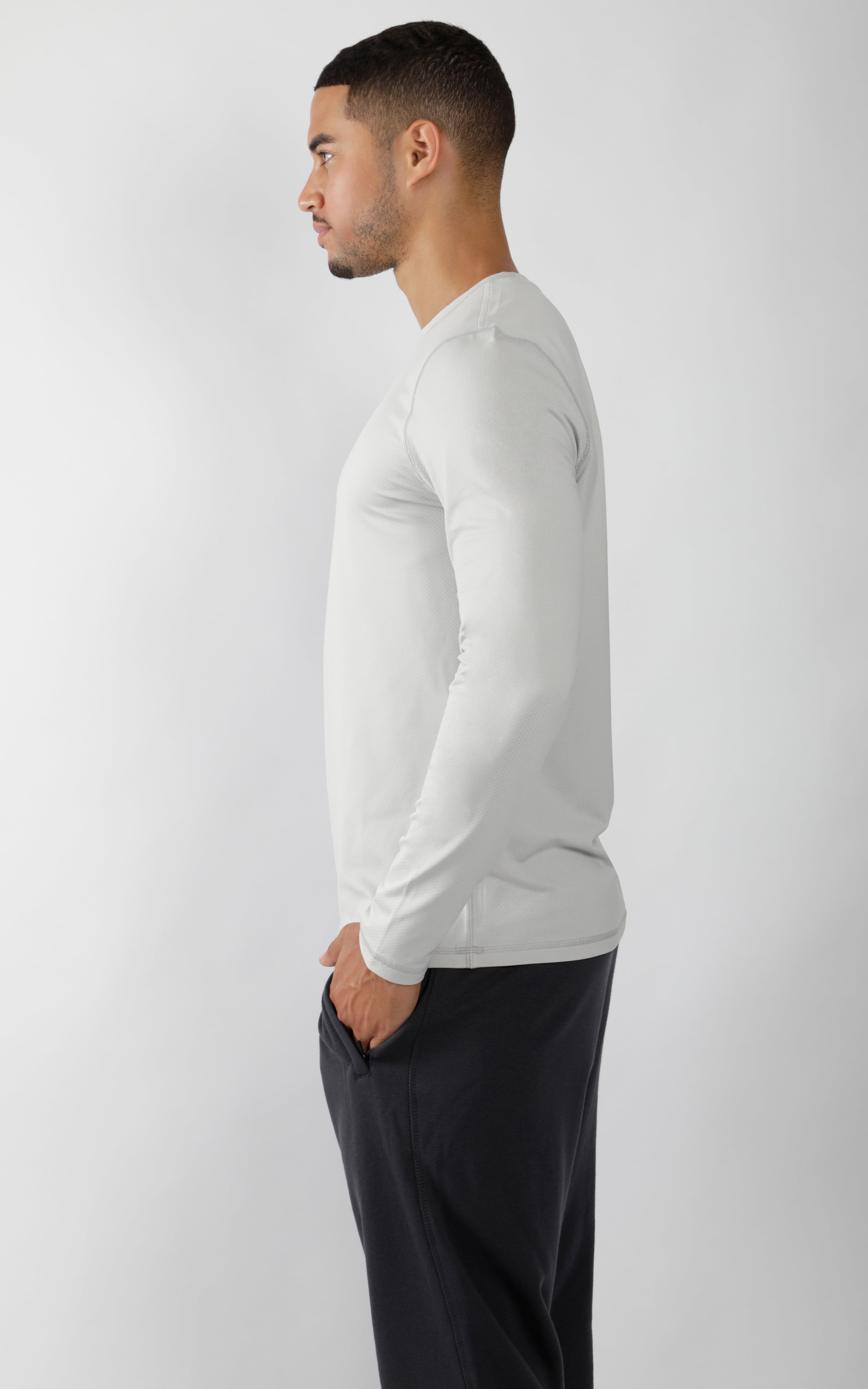Men's light grey crew neck long sleeve shirt with a slim fit and soft fabric.