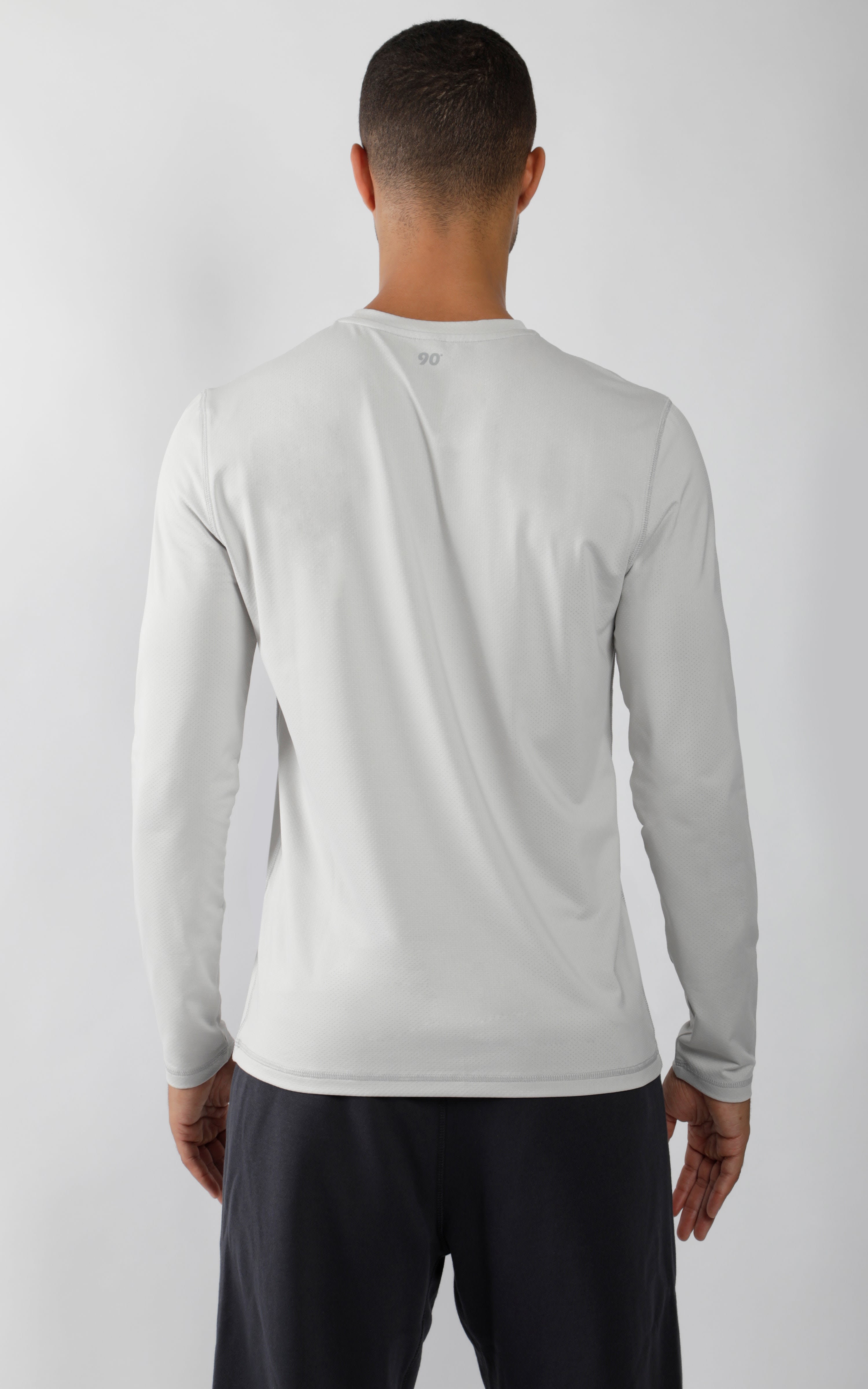 Men's long sleeve crew neck shirt in light grey, shown from the back, slim fit.