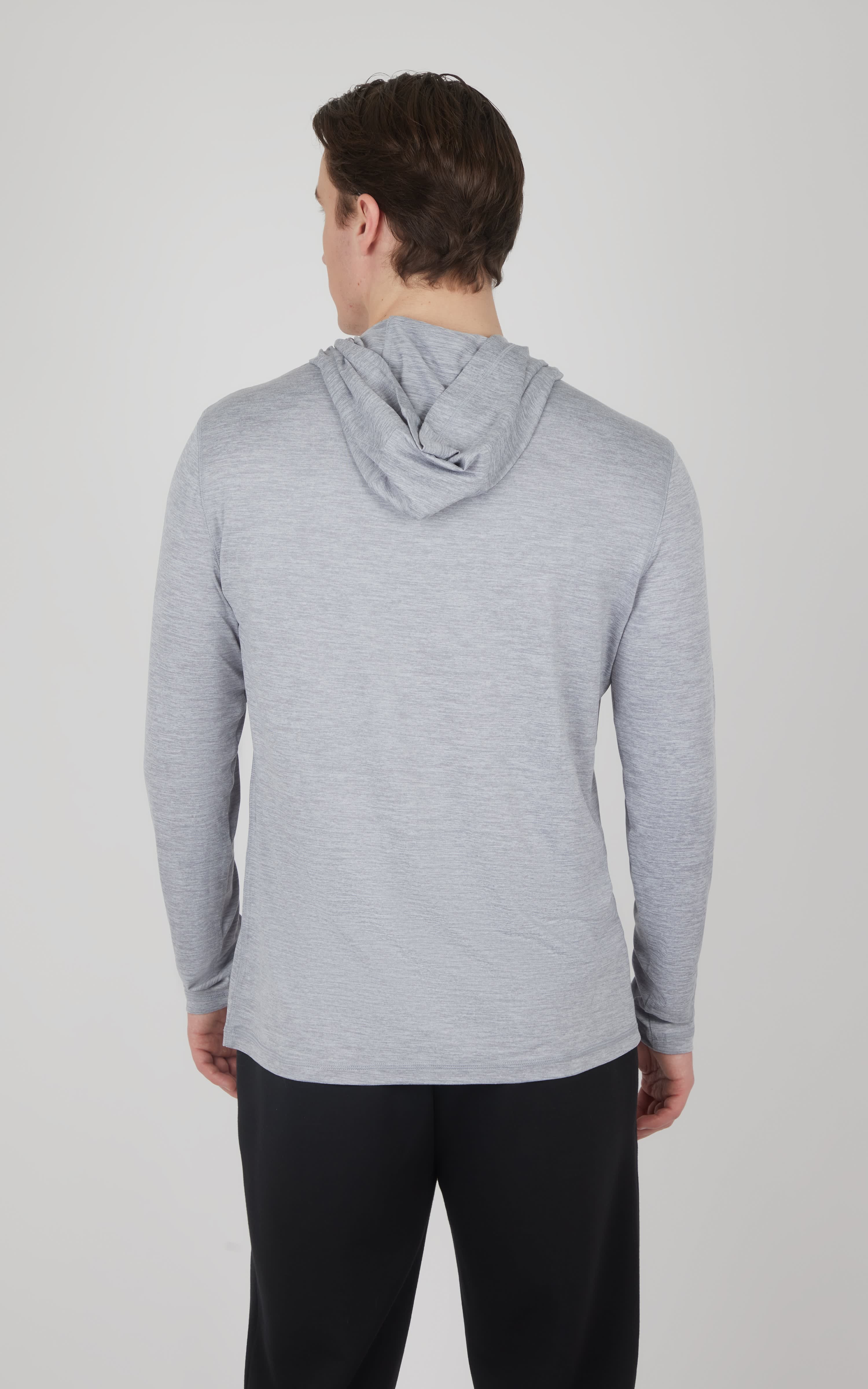 Light gray cationic long sleeve hooded shirt with relaxed fit on male model, back view.
