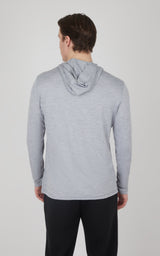 Light gray cationic long sleeve hooded shirt with relaxed fit on male model, back view.