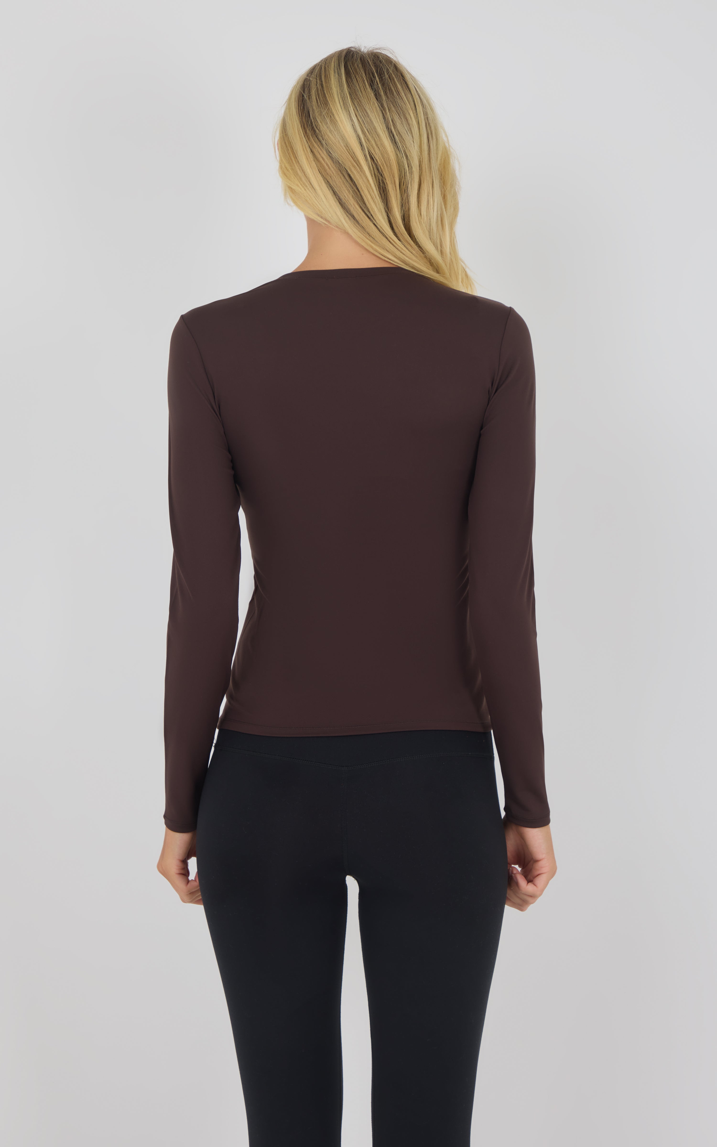Long sleeve fitted top in chocolate torte brown with crew neckline, shown from back.