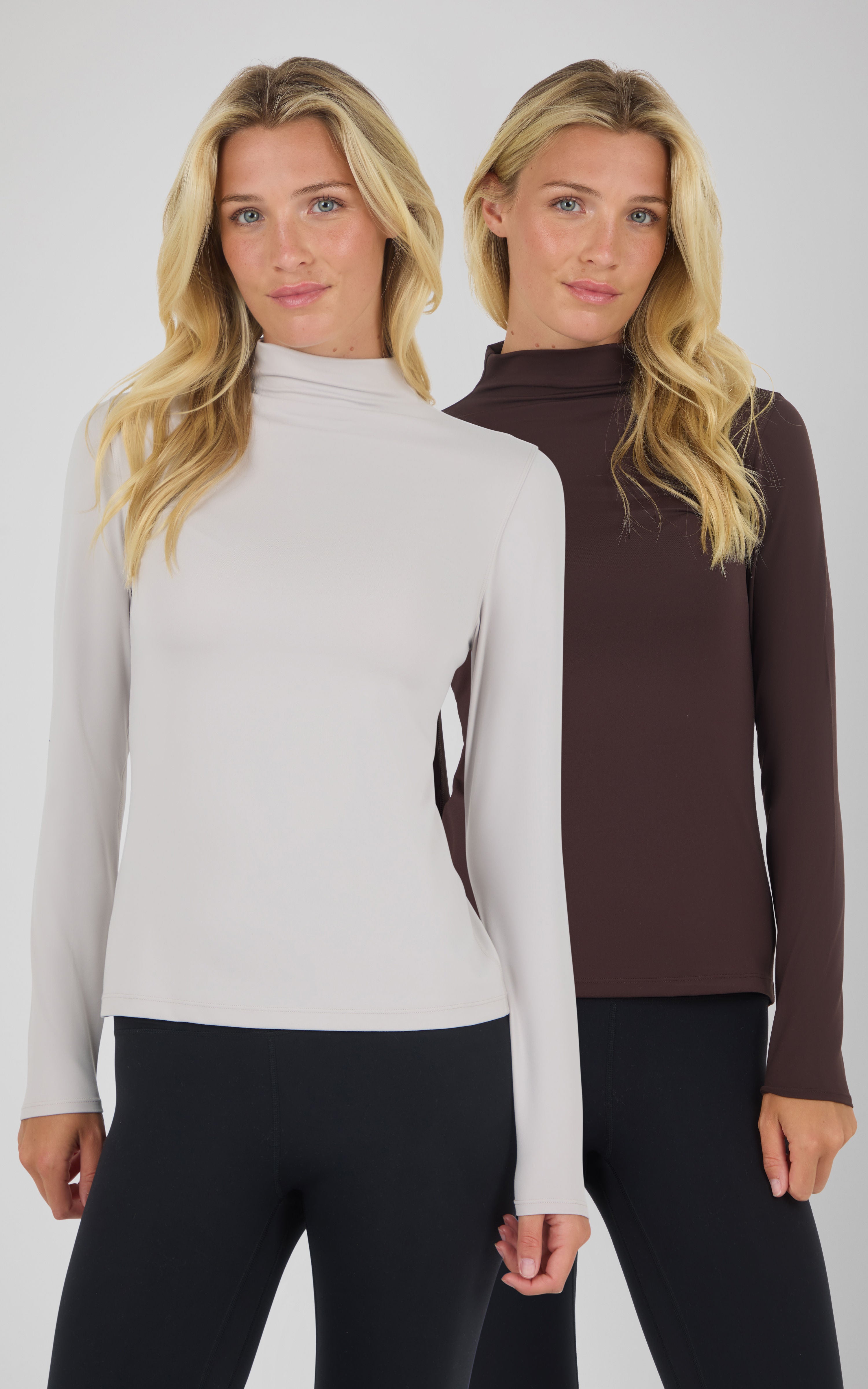 Two mock neck long sleeve tops in light beige and dark brown on models with slim black pants.