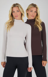 Two mock neck long sleeve tops in light beige and dark brown on models with slim black pants.