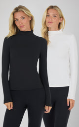 Two women wearing Zenly Evelyn mock neck long sleeve tops in black and white, fitted style with thumb holes.