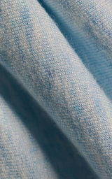 Close-up of soft modal terry fabric in heather serenity sky blue with fine knit texture.