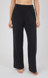 Black marled pique wide-leg pants with a relaxed fit, elastic waistband, and full-length hems.