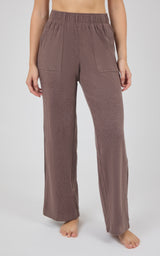 Taupe-brown marled pique lounge pants with a gathered elastic waist, side pockets, and relaxed wide legs.