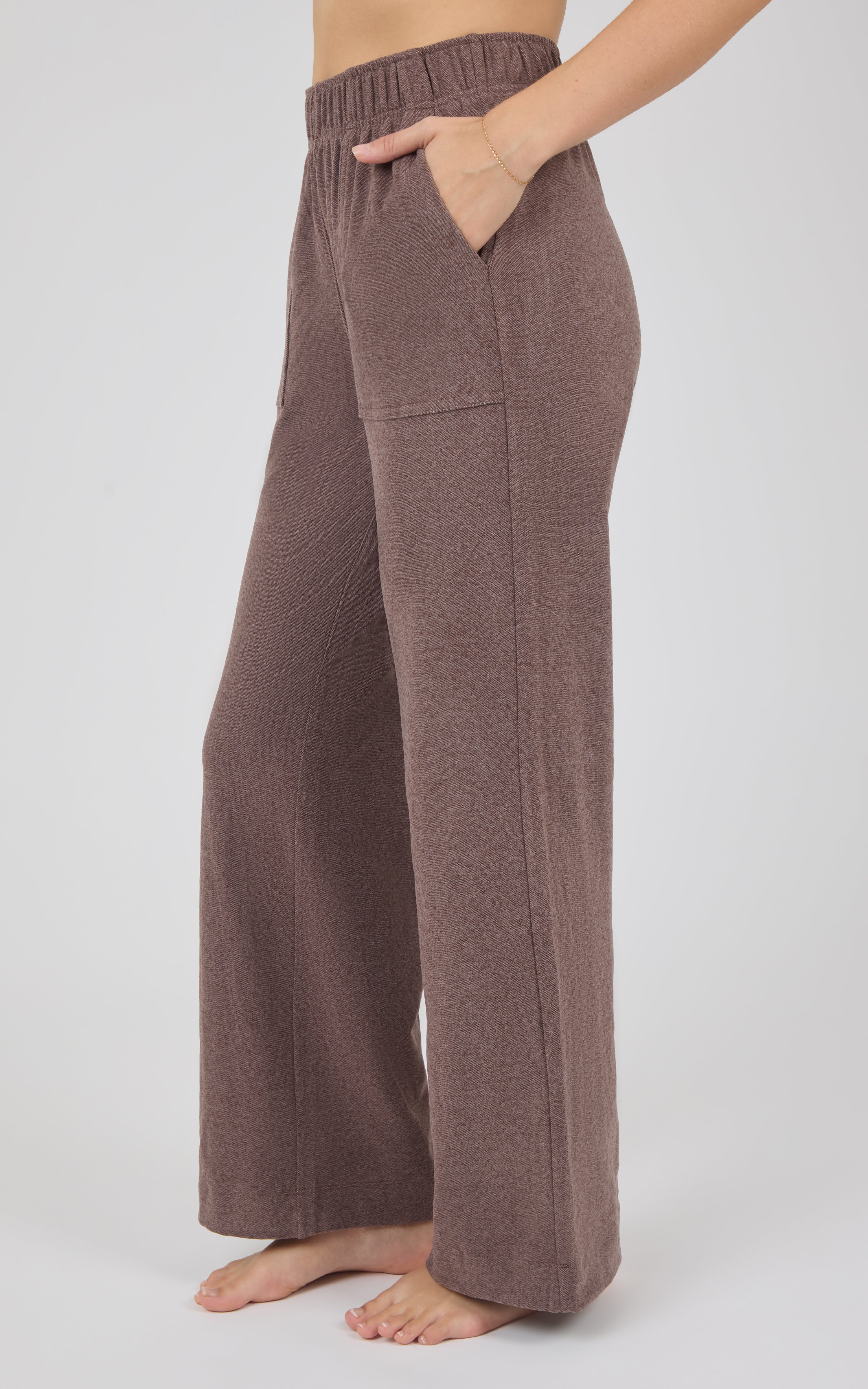 Brown marled pique lounge pants with a wide-leg silhouette, elastic waistband, and relaxed fit, shown on a model.