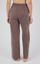 Back view of mauve-brown marled pique wide-leg pants with an elastic waistband, rear pockets, and full-length straight hems.