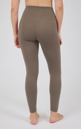 Taupe high-rise full-length leggings with a smooth, stretchy finish and a wide waistband, shown from the back.