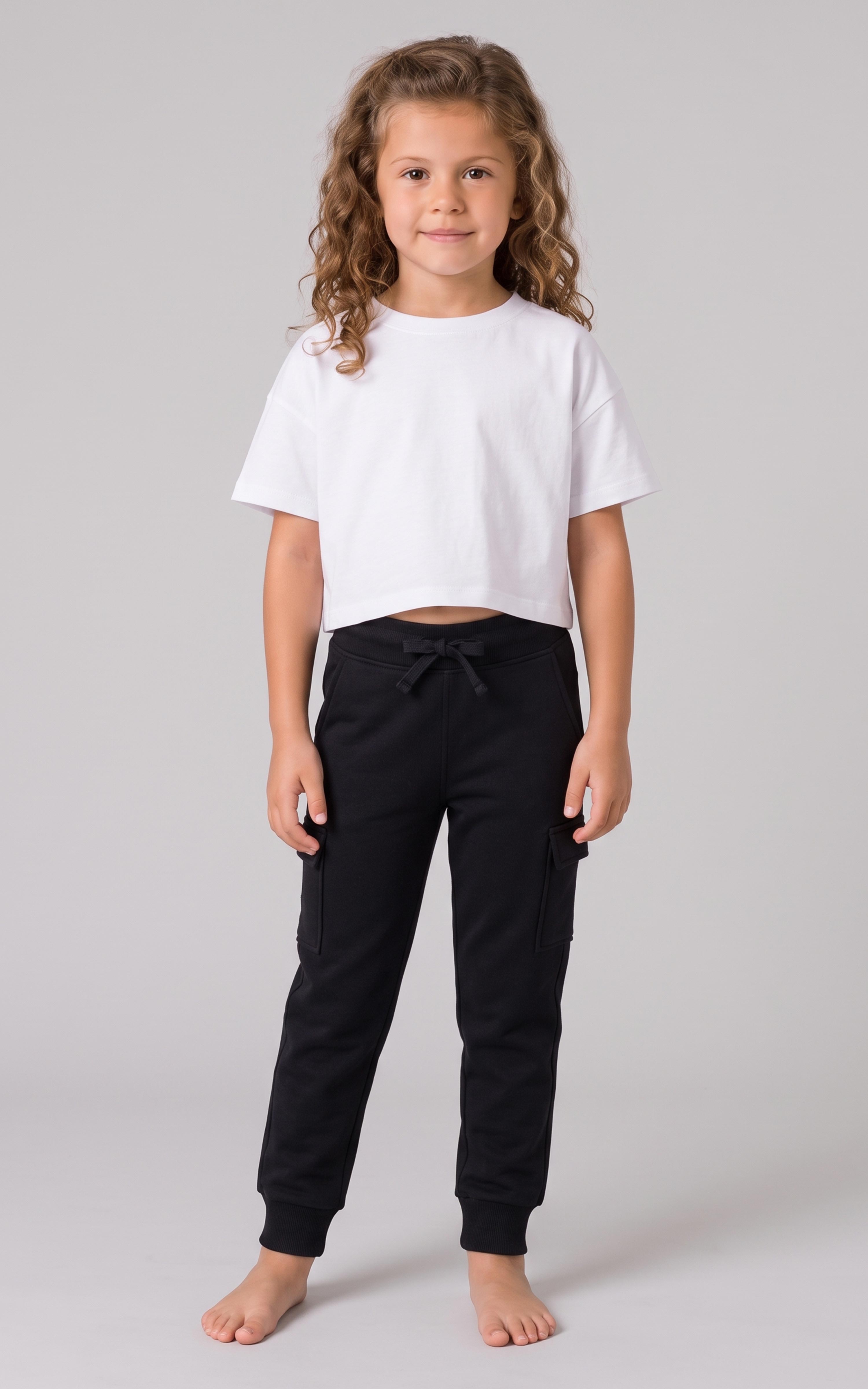 Girl modeling black tapered jogger pants with a drawstring waist and side pockets.