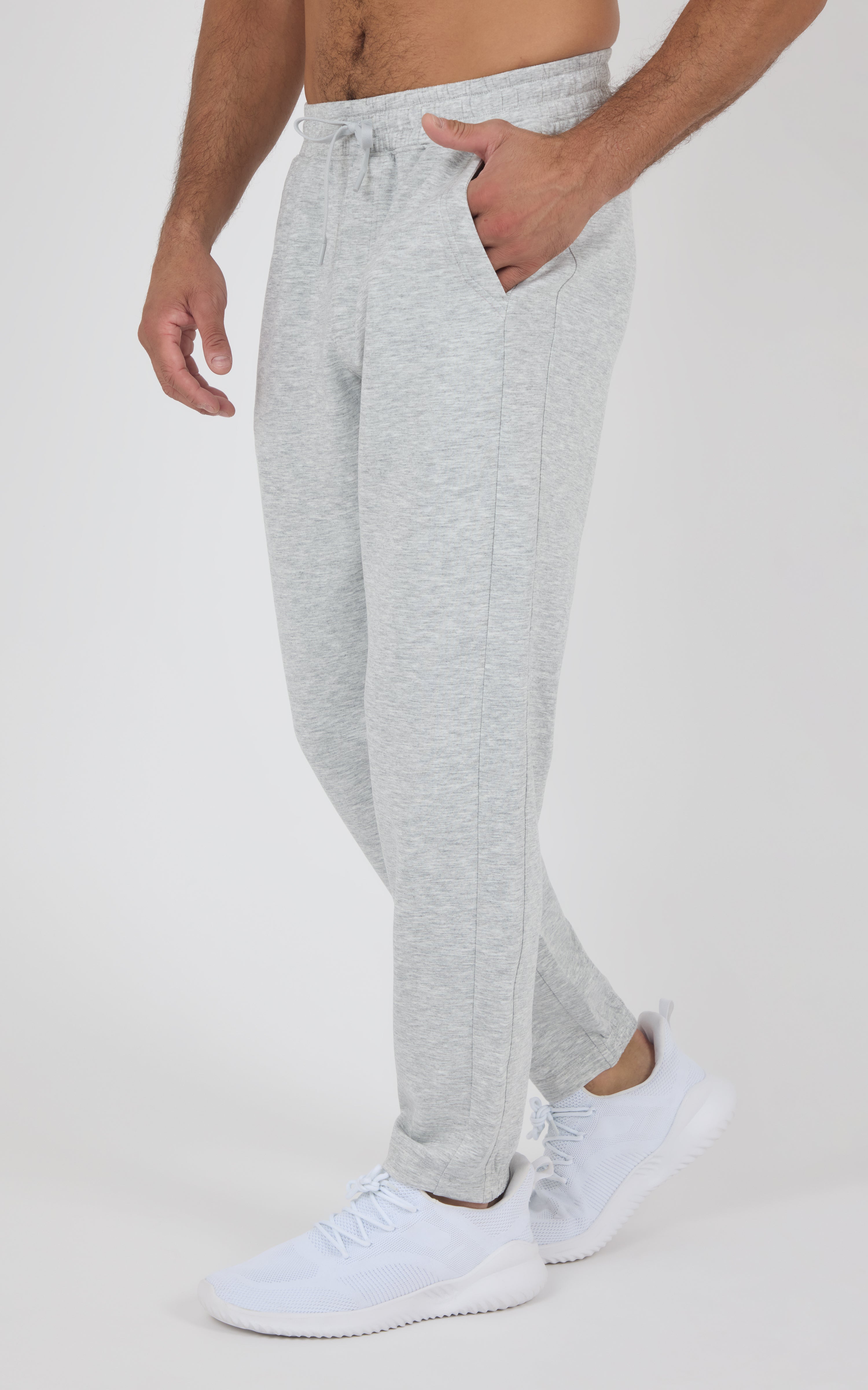 Light gray Softlite joggers with a drawstring waist, tapered legs, and ribbed cuffs, styled with white sneakers.