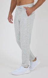 Light gray Softlite joggers with a drawstring waist, tapered legs, and ribbed cuffs, styled with white sneakers.