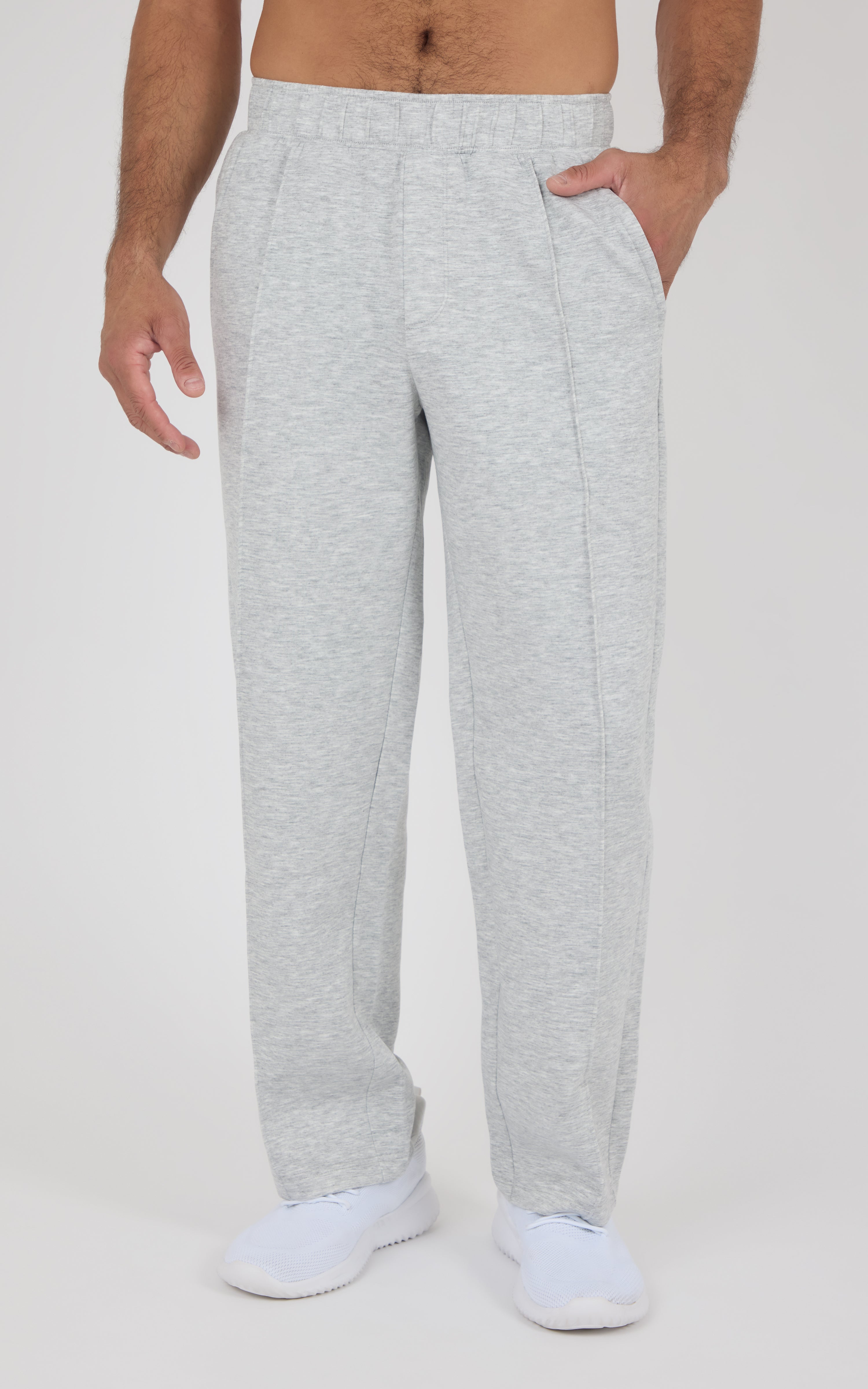Light gray straight leg pants with relaxed fit, elastic waistband, side pockets, and soft fabric texture, worn with white.